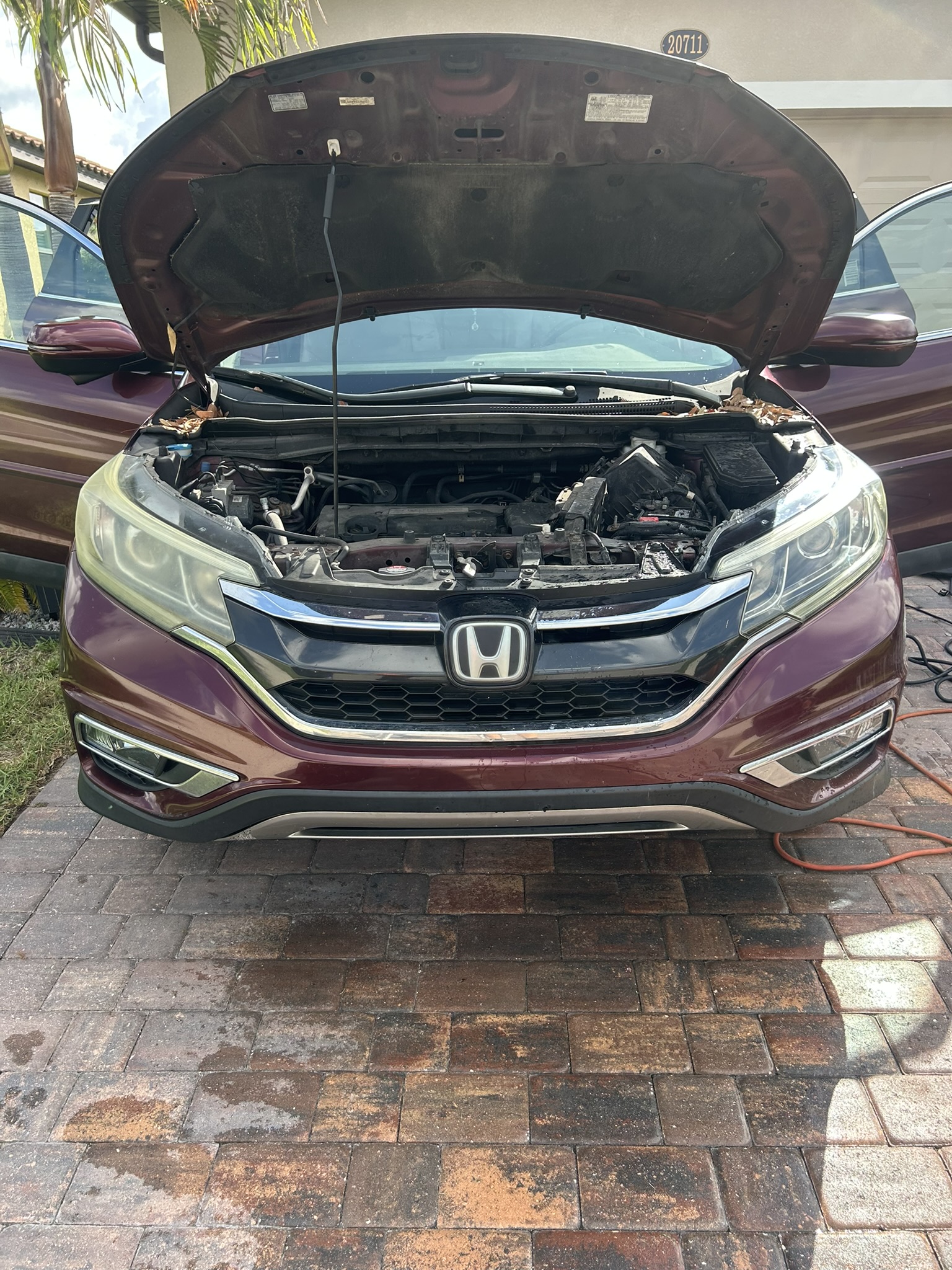 Mobile headlight restoration work setup on Honda SUV